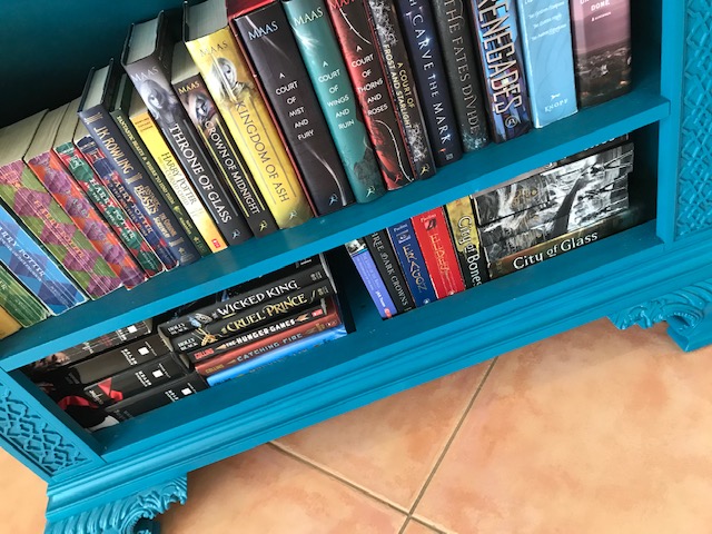 My blue bookshelf full of my favorite books